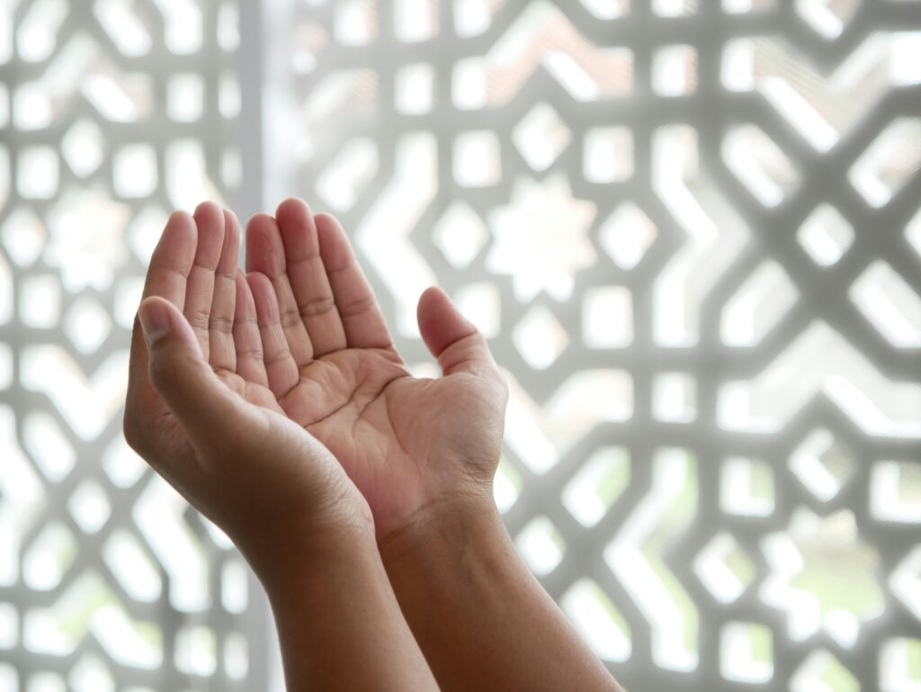 https://unsplash.com/photos/a-person-holding-their-hands-up-in-front-of-a-window-QhzQfD0ihnI